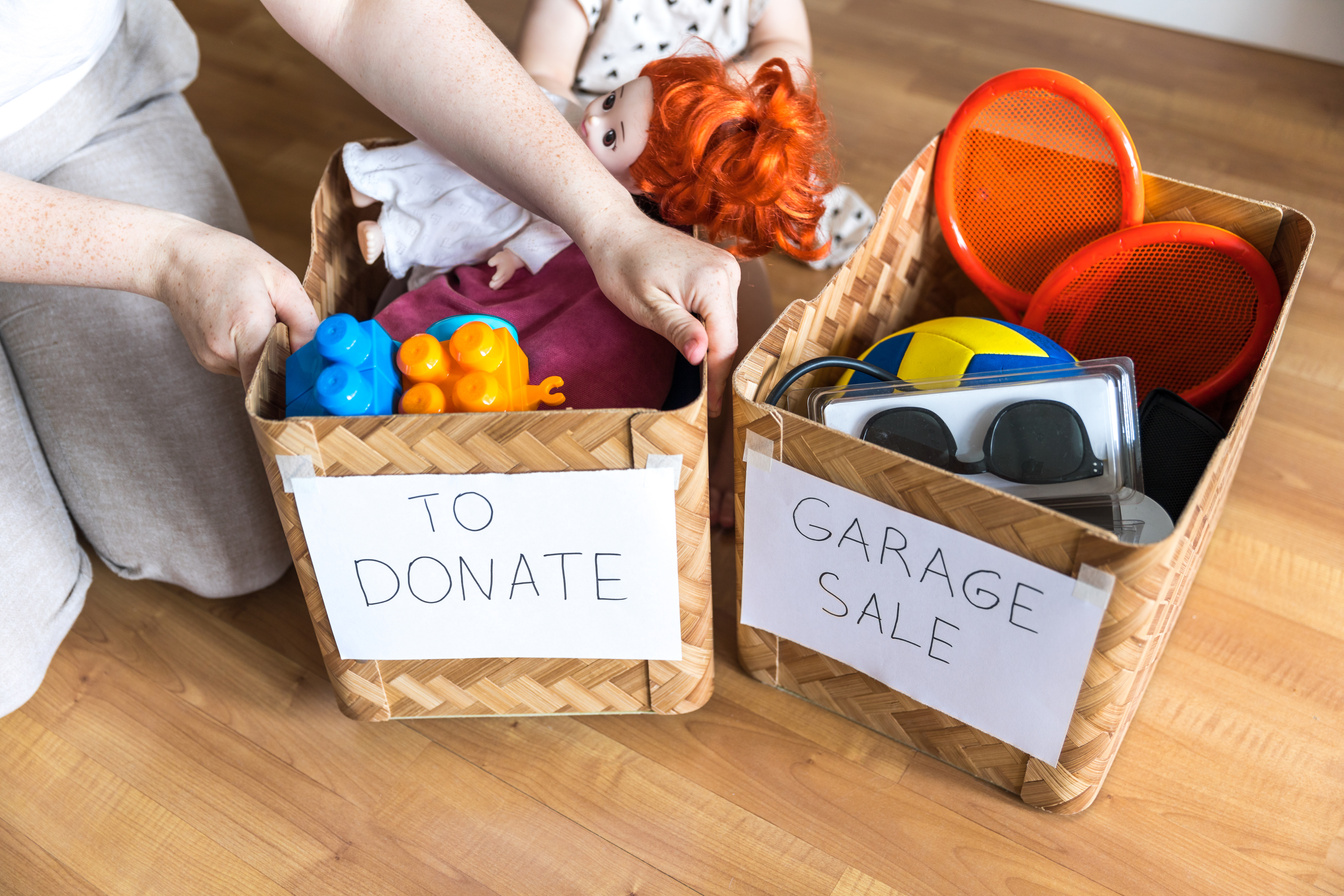 Boxes of things for a garage sale and donation. Decluttering, cleaning and moderate consumption for a sustainable life