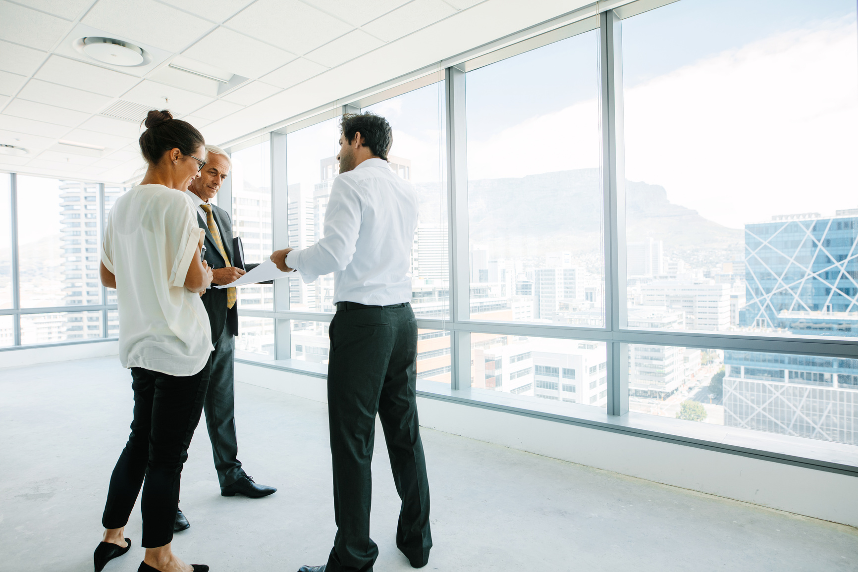 Real Estate Agent Talking with Clients 